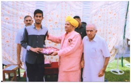 Chief Guest awarding Sh. Sanjay Rathore for securing 19th position in J&K BOSE 10th class 2016