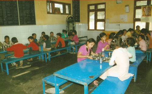 Small Boys and Girls Taking Meals in Girls Mess.